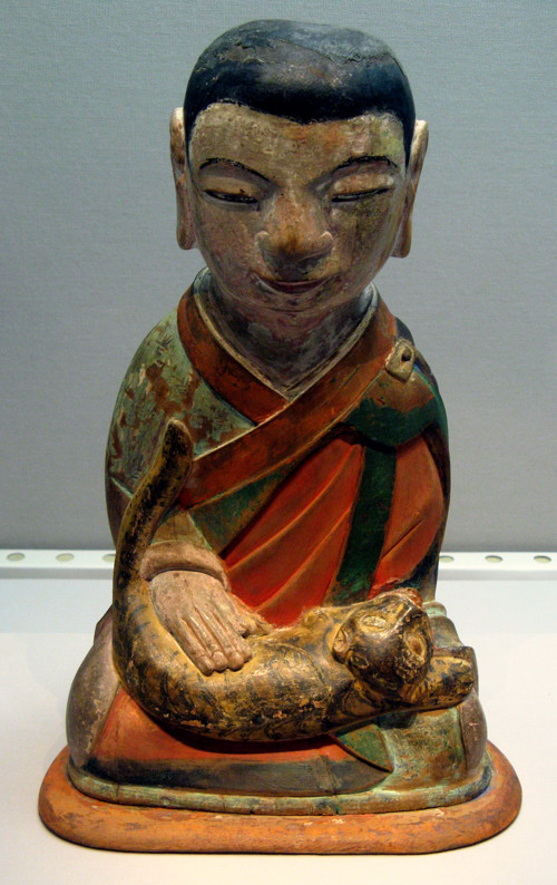 Terracotta boy with striped cat at National Museum of Korea